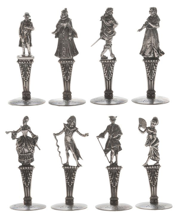 Set of Eight French Silver Place Card: Holders French, 20th century, eight different figures in colonial dress standing on a acanthus post, .800 fine, monograms, 1.87 oz. T., 2-1/8 in., several bent, otherwise good condition. Provenance: P