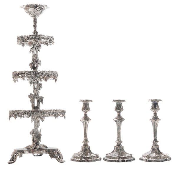 Silver-Plate Four Tier Tazza, Three: Plated Candlesticks British or American, 19th/early 20th century: the tazza with grape and leaf decoration, pseudo hallmarks, 25-1/4 in., [polish wear and residue, lower two tiers separated from bases