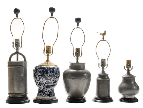 Five Assorted Early Lamps: 18th and 19th centuries, comprising a Delft blue and white vase now mounted as a lamp, [reduced at rim, mouth not removed;] with four various pewter canister-form lamps, [generally good condition, som