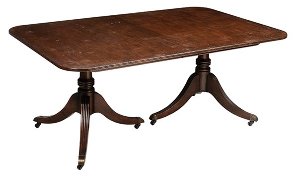 Baker Regency Style Banded Two: Pedestal Mahogany Dining Table 20th century, underside with Baker metal tag, top with figured veneers and banded edge, turned supports and tripod bases, opens to accommodate additional leaves, 29 x 43