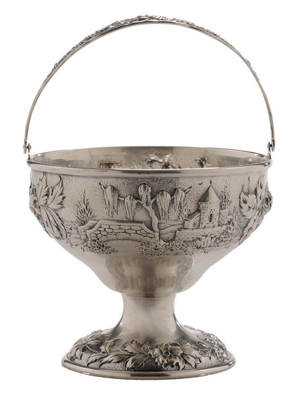 Kirk Sterling Sugar Basket: American, 1896-1924, round with repouss e castle and floral decoration, bale handle, marks for S. Kirk & Son Co., no monogram, 7.44 oz. T., 6 x 4-1/2 in., polishing abrasion, small dents. Provenance: