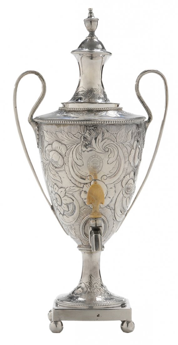 George III English Silver Diminutive: Hot Water Urn London, 1783, urn form with reeded handles, urn finial, square base with ball feet, ivory? spout finial, marks for Thomas Chawner, heraldic device with crown, tree and saw, belt and buck