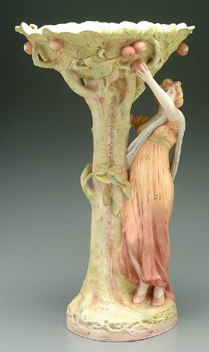 Majolica figure of woman picking fruit f