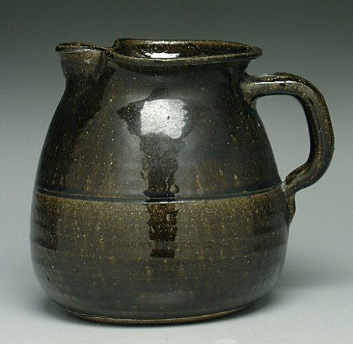 Stoneware pitcher, pinched spout, dark g: Stoneware pitcher, pinched spout, dark glossy alkaline glaze, base marked "Lanier Meaders," minor surface scratches, 7" (Bookout Collection)