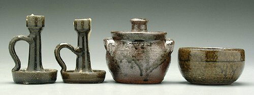 Four pieces Lanier Meaders alkaline-glaz: Four pieces Lanier Meaders alkaline-glaze stoneware: two chamber sticks, dark olive glaze, wax residue, inscribed "Lanier Meaders," 4-1/2" and 4-7/8"; lidded sugar bowl, inscribed "Lanier Meaders," 4-