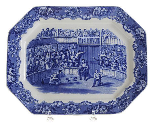 Flow Blue Cockfighting Platter: English, 19th century, octagonal platter depicting a cockfight, flaring floral border, marked verso "Spanish Festivities 1798", 14 x 11 in., minor glaze anomalies to base rim, otherwise good condition