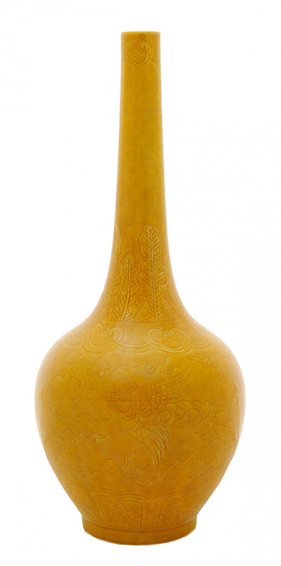 Ming Style Mustard-Ground Incised: Scenic Bottle Vase Chinese, late 19th/early 20th century, long neck above bottle-form body heavily incised with flying phoenix birds, stylized clouds, repeating border bands, unglazed circular base wi