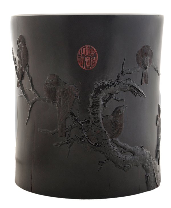 Carved and Black-Lacquered: Hardwood Brush Pot Chinese, 20th century, body carved with birds on a branch and stamped with calligraphy poetry, red chop at top, circular base, 9-1/4 in. minor wear at inside of top rim