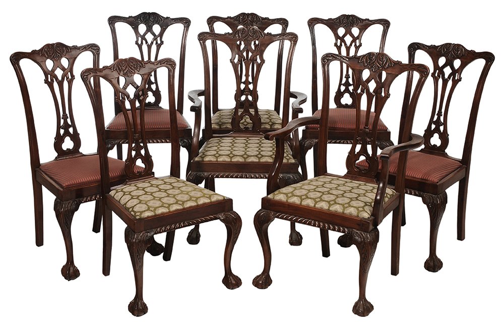 Set of Eight Chippendale Style Carved: Mahogany Dining Chairs early 20th century, leaf-carved crest and pierced gothic splats, cabriole legs with ball-and-claw feet, four salmon and gray upholstery, four cream and green upholstery, two arm