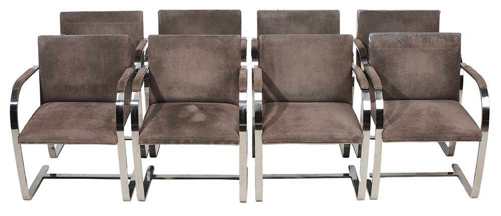 Set of Eight BRNO Armchairs by Knoll: designed by Mies van der Rohe, each with chrome frame and charcoal suede upholstery, suede arm pads, upholstery scrims with labels "Distributed by Knoll, Inc.", 31-1/2 x 23 x 21 in., frames generally 