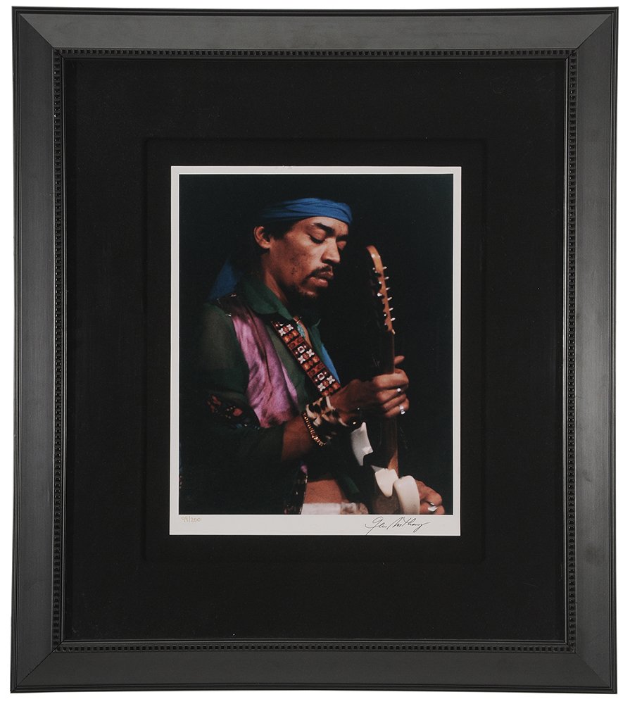 Jimi Hendrix Limited Edition: Photograph originally shot 1969, by Gene Anthony, close-up of the musician playing at the Oakland Coliseum in California, recto signed by artist in black ink lower right and numbered 99/200 lower left