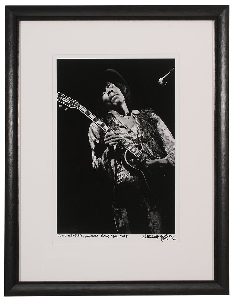 Jimi Hendrix Limited Edition: Photograph 1968, by Elliott Landy, 3/4 length portrait of the musician playing at the Fillmore East in New York City, recto signed by artist and numbered 44/100 in black marker lower right, titled low
