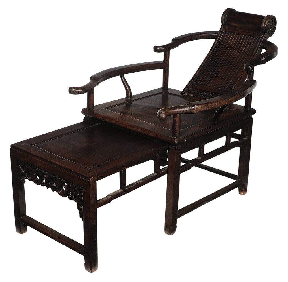 Fine Antique Carved Hardwood: Opium Chair Chinese or possibly export, 18th or 19th century, dense figured hardwood throughout, possibly [huanghuali], cylinder-form crest with prunus-carved ends, reeded reclining back with foliate 