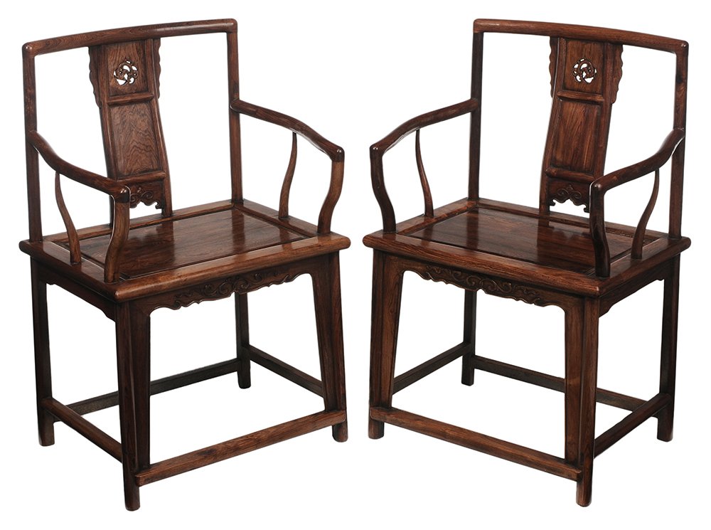 Pair Chinese Carved Rosewood Open-: Arm Chairs 20th century, each with dragon-carved pierced splat and paneled seat, tenoned construction, 37 x 24-1/2 x 18 in., good condition with minor shrinkage and scattered minor surface flaws. Prov