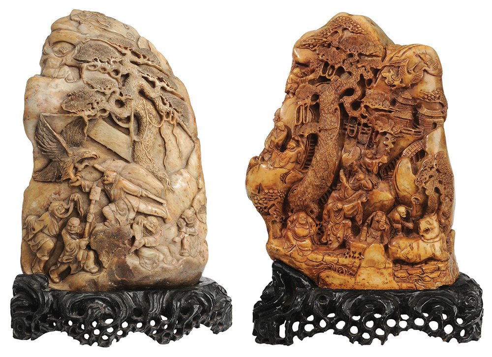 Two Figurally Carved Soapstone: Boulders Chinese, 20th century: one depicting a seated figure with a dragon under a tree, verso carved with figures and bird of prey, amber to gray in color, 16 x 10-1/2 in.; one amber-colored with nu