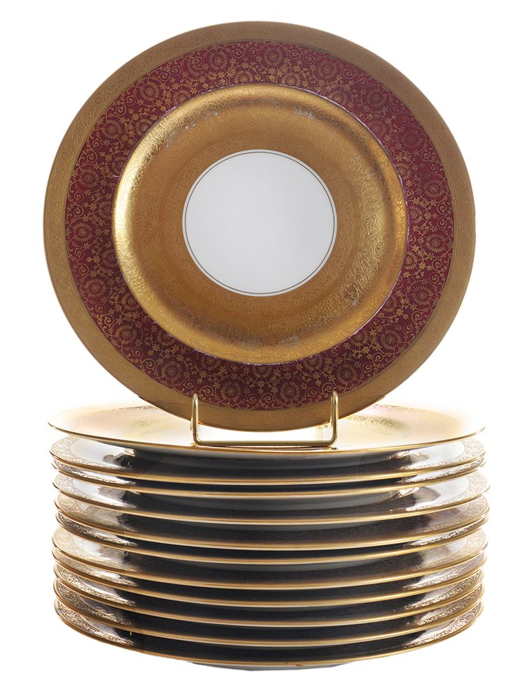 Twelve Bavarian Porcelain Service: Plates German, 20th century, each with white center, deep gold and burgundy floral-banded rim, heavily gilt border, stamped below "H&C Selb Bavaria Heindrich & Co/Retailed by John Wannamaker", 10-7/8 