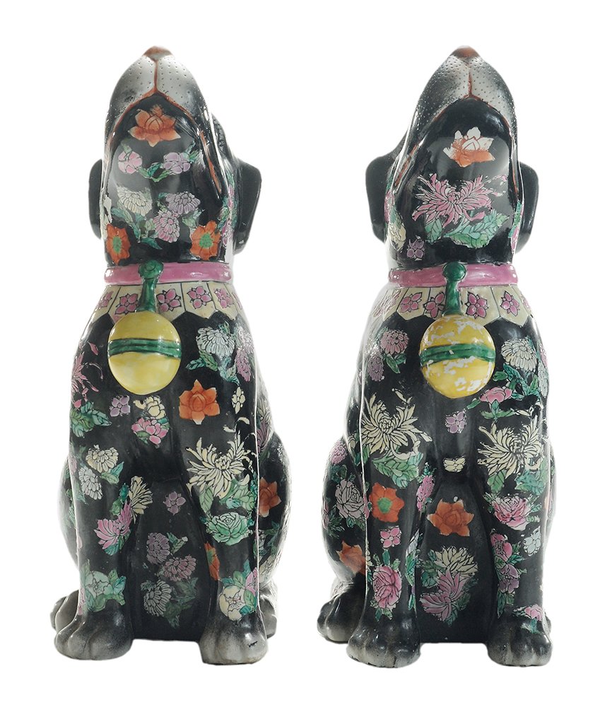 Pair Famille Noir Chinese Export: Style Enameled Dog Figures Chinese, dogs looking upwards, heavily enameled with overall designs and yellow balls, brick-red seal marks, 14 x 9-1/4 x 5 in., areas of enamel loss to tail and body and ye