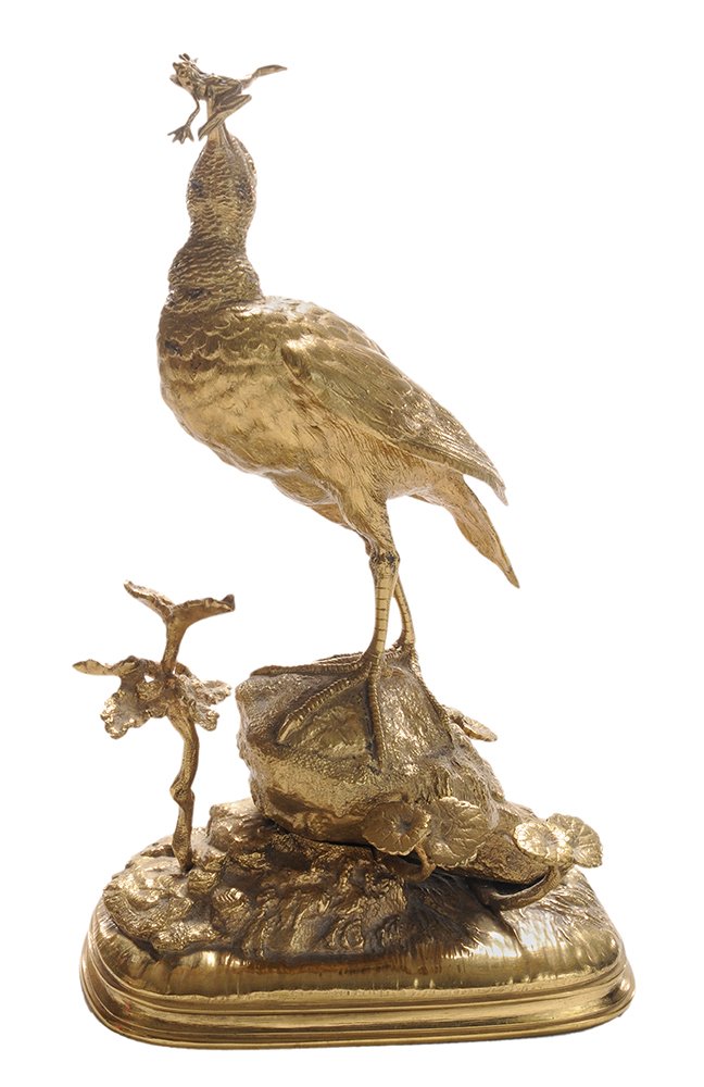 Ferdinand Pautrot: (French, 1832-1874) gilt bronze figural group of a shorebird catching a frog and standing on a rock with plants on a naturalistic mound, oval stepped base signed "Pautrot", 10-3/4 in., Frog's right fo
