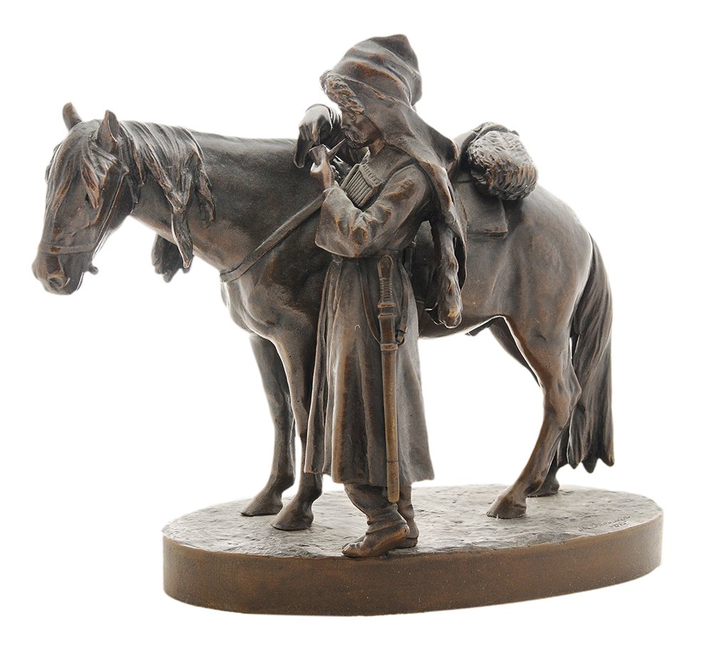 Albert Moritz Wolff: (German/Russian, 1854-1923) A Caucasian Cavalryman Smoking a Pipe, signed in cyrillic "M. Вольфъ 1893.", patinated bronze, 8-1/4 x 10 x 5 in., figure slightly loose