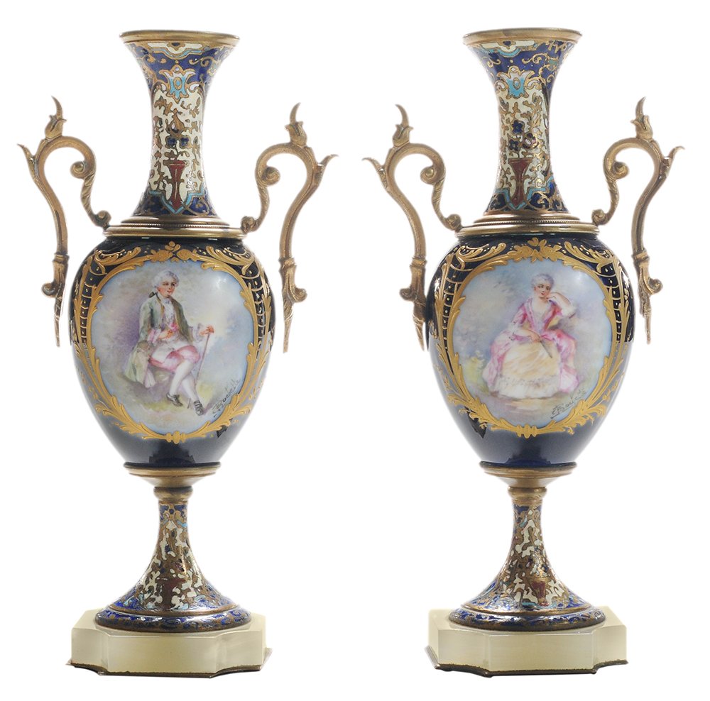 Pair Hand-Painted Sèvres-Style: Porcelain Vases French, late 19th century, each signed "S Rochette", extended flaring necks and black bodies, champlevé enamel with geometric devices and hand-painted figures, two gilt handles, champ