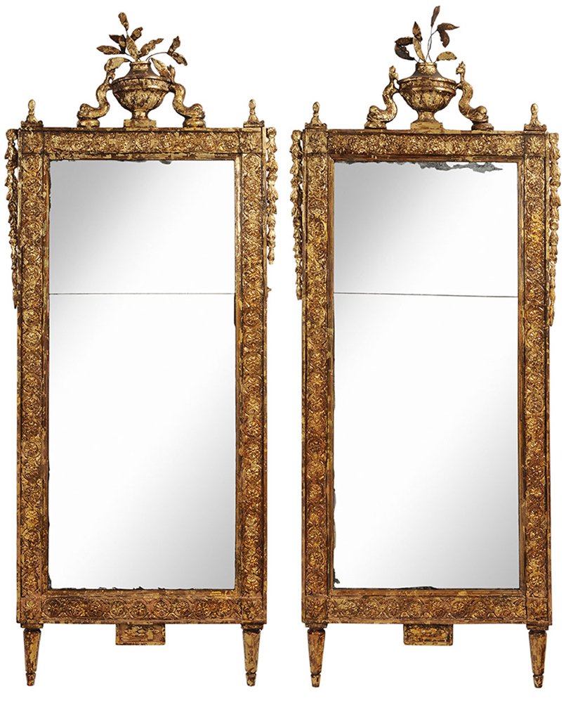 Pair Venetian Neoclassical Style: Carved and Gilt Wood Mirrors each with urn and dolphin crest over a two-part distressed mirror plate with carved surround, distressed gilded surface, 70 x 28 in.,