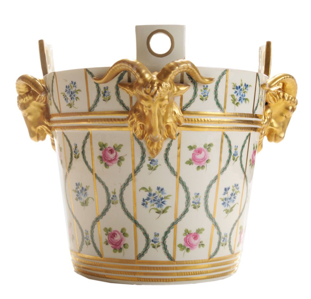 Fine Dresden Hand-Painted and Gilt-: Decorated Ram's Head Jardinière French, 20th century, four circular cut-out handles above gilt rams' heads, body with flowers and leaves alternating with blue floral sprays, gilt bands above and belo