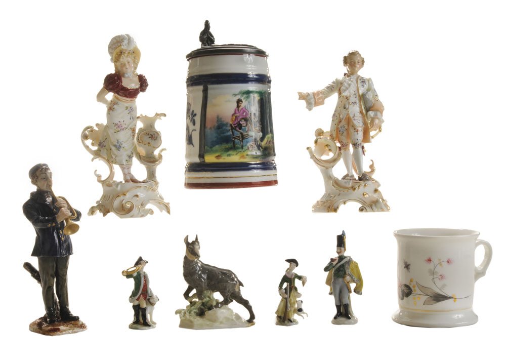 Nine Pieces Continental Porcelain: man and woman in elaborate dress, gilt highlights, scrolling gilt bases, each with crossed swords mark in underglaze blue, "W", 7 in., [she with small loss at hand and back of woman, both with losses