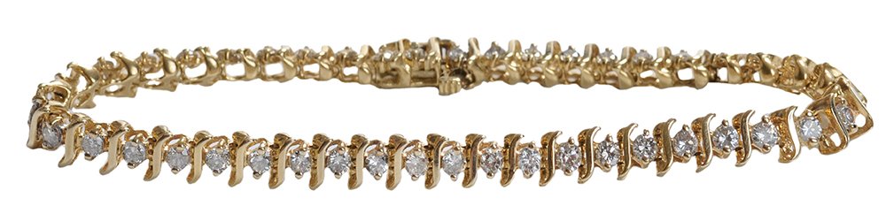 Diamond and Gold Tennis Bracelet: set with 44 round brilliant diamonds, estimated combined weight 4.0 cts., color H-J, clarity SI-I, 14 kt. yellow gold "S" link chain, 7 in. x 5.2 mm., 12.4 grams gross weight light wear
