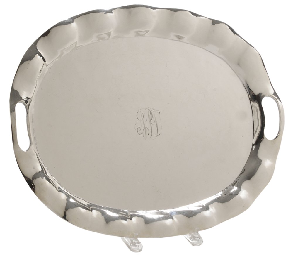 Hammered Sterling Two-Handle Tray: Mexican, 20th century, oval with shaped border, monogram, 47.21 oz. T., 18-3/4 in., light scratches. Provenance: Collection of Kent Darling Garbee, Athens, Georgia
