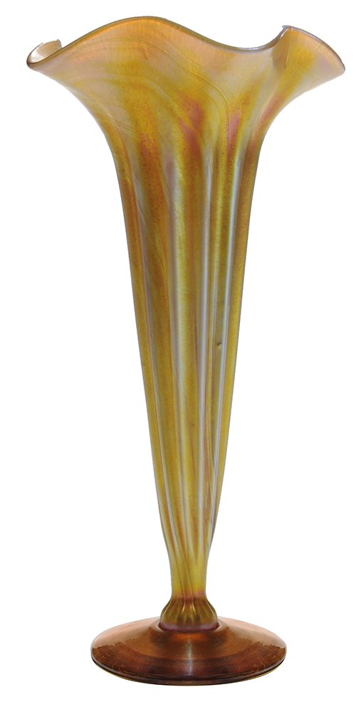 Tiffany Studios Favrile Glass Trumpet: Vase American, early 20th century, ribbed body on pedestal base, signed "LC Tiffany Favrile", "7018-D", 11-5/8 in., minor scratches to bottom. Provenance: Estate of Timothy Storrs, Tit