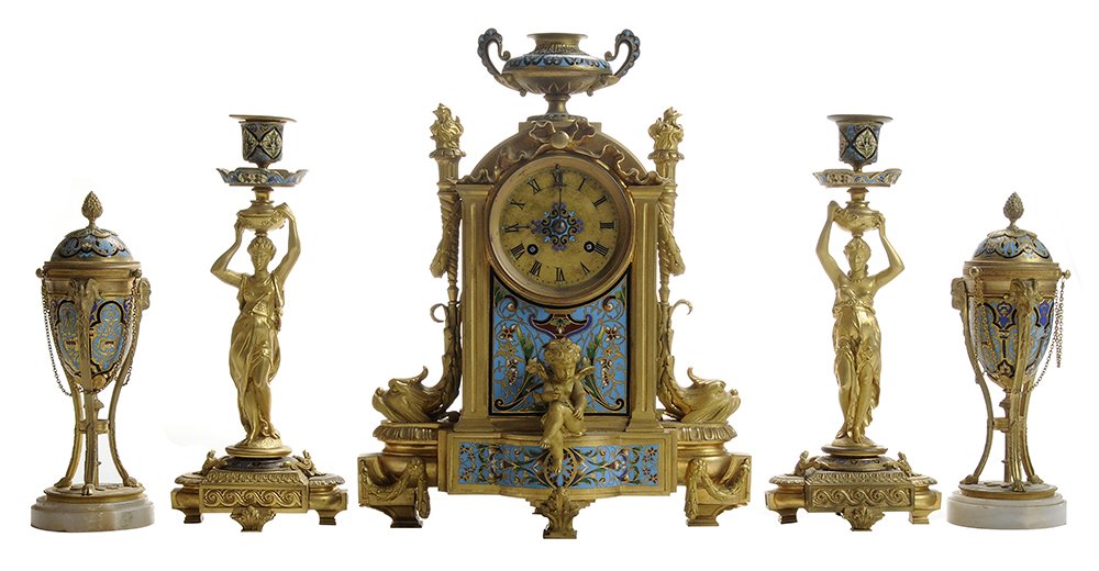Gilt Bronze and Champlevé Three-: Piece Clock Garniture Set, Pair Cassolette Urns French, late 19th/20th century: mantle clock with urn and flanked by flambeau supported by dolphin masks, seated putto to front, brass dial with Roman c