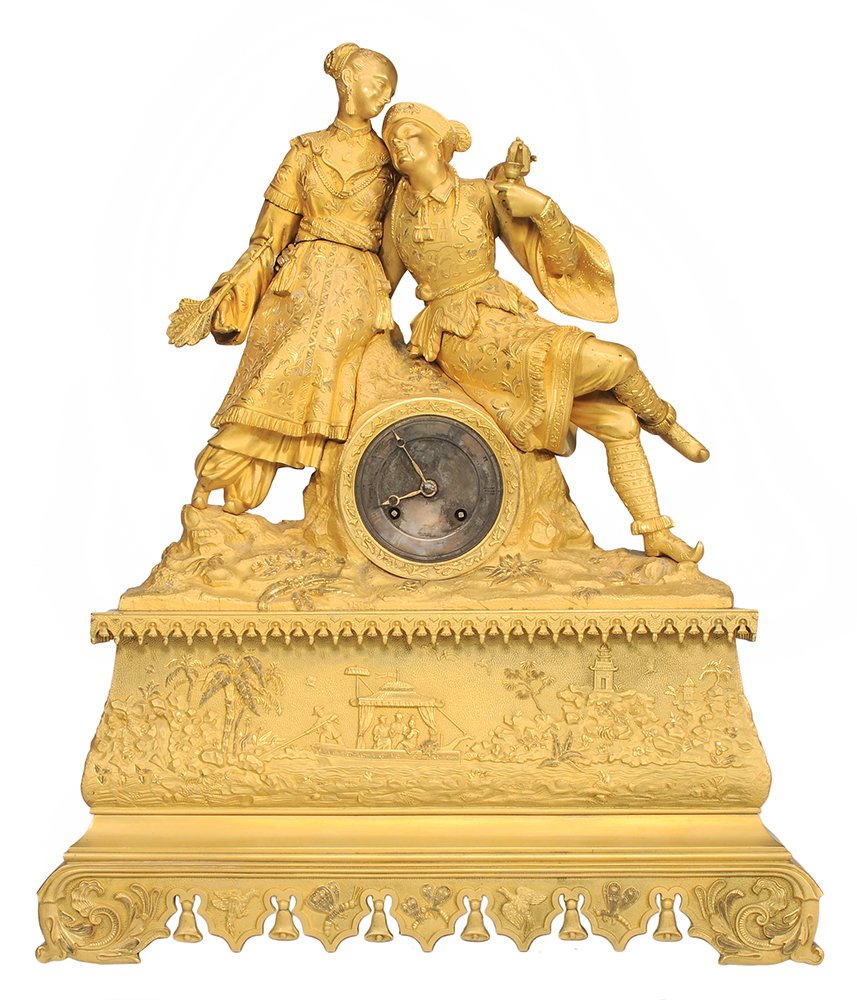 Louis Philippe Gilt Bronze Asian Style: Mantle Clock French, 19th century, brass works stamped "Guy E. Erdetaine Paris", "3180", copper dial below two Asian figures, standing woman pouring tea and seated man, both in elabora