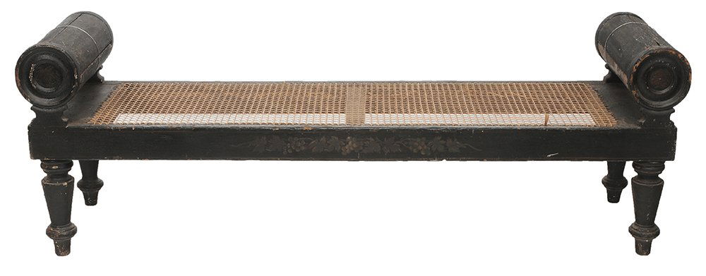 American Classical Paint-Decorated: and Caned Window Bench probably Baltimore or Philadelphia area, circa 1820s, caned seat with bolster-form ends, turned legs, black paint, 24-3/4 x 73-3/4 x 20 in., poor condition with extensive paint