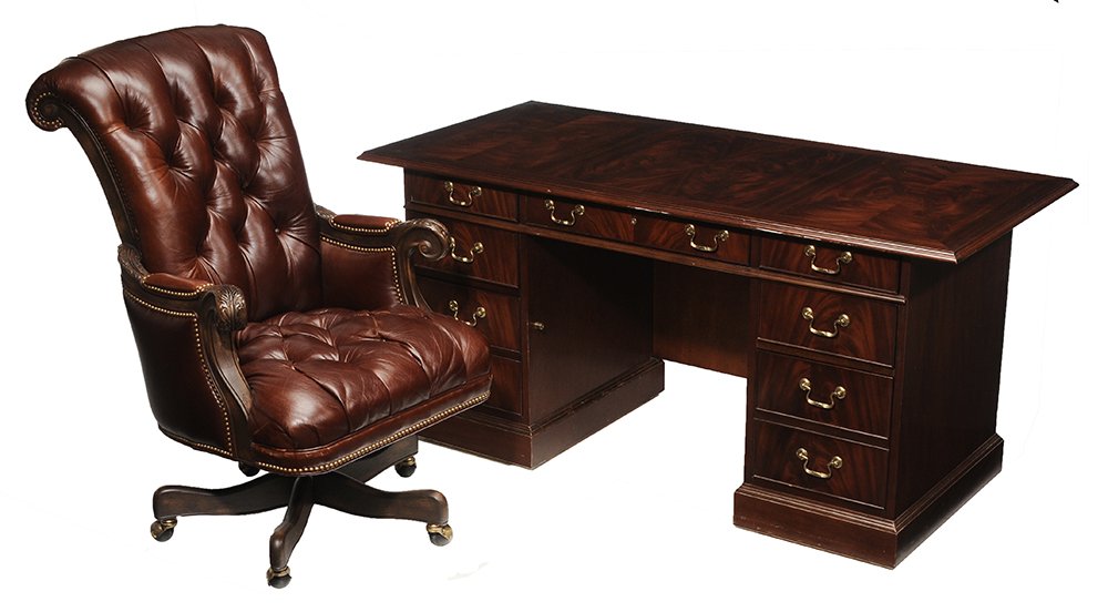 George III Style Mahogany Pedestal: Desk, Leather Swiveling Chair banded inlaid top with glass cover, nine drawers, 30-1/2 x 64 x 30 in.; together with a leather tufted-upholstered swiveling chair with label for Hancock & Moore, 44 