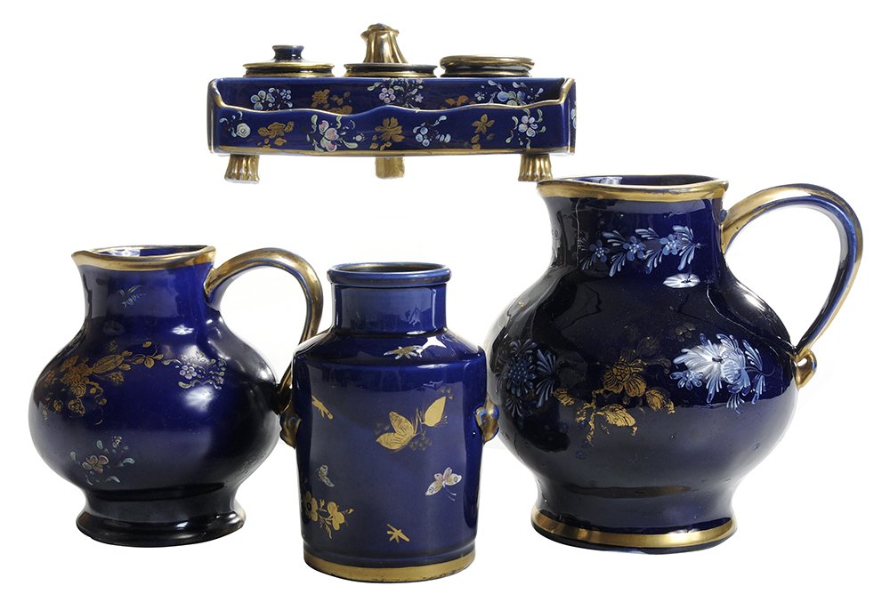 Four Pieces Mason's Ironstone with: Gilt and Pastel Flowers English, circa 1815-1825, mazarine blue with gilt and pastel enameled flowers, ink stand with scrolled loop handle on back and pen tray across front, three animal paw feet, lif