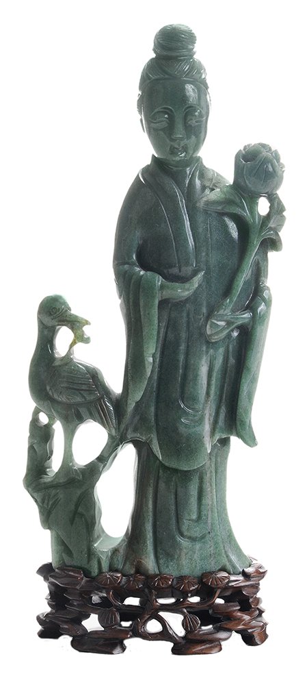 Carved Green Jade Standing: Quanyin with Attendant, Converted to Table Lamp Chinese, late 19th/early 20th century, Quanyin dressed in elaborate gown and holding a ruyi scepter, with attendant and standing on a rocky mound, surro
