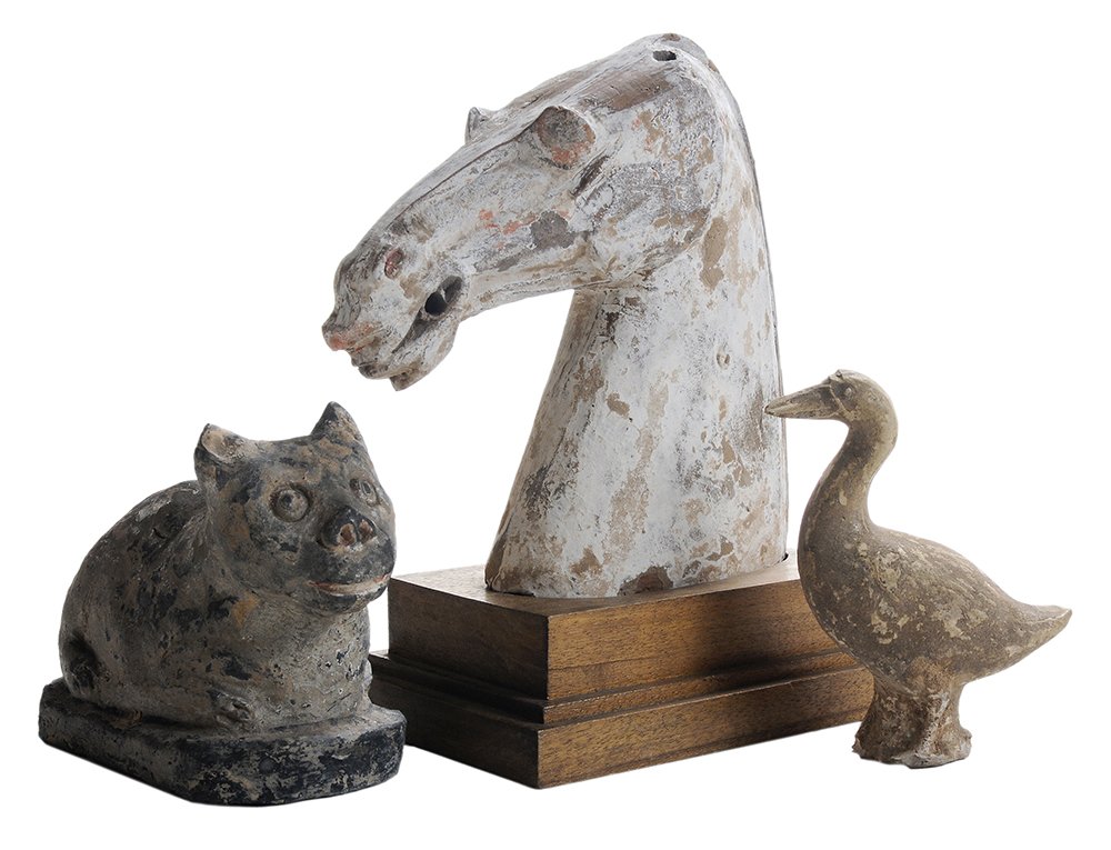 Three Early Chinese Ceramic Figures: polychromed ceramic horse's head, probably terracotta, traces of red and white pigment, mounted on wooden plinth, 8 in., generally good condition, surface wear and pigment losses, minor chips and wear