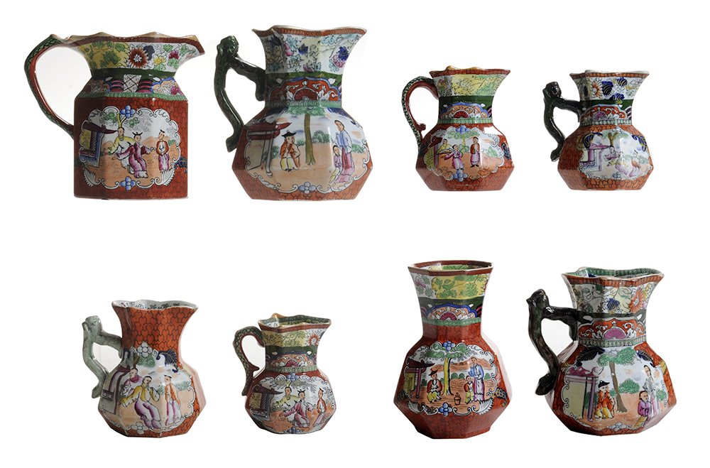 Seven Mason's "Red Scale" Pattern: Jugs, Vase English, most 1835-1840, paneled bodies with red-scale ground and vignettes of Chinese daily life, decorative borders top and bottom, seven hydra-shaped jugs with black Mason's mark, four w