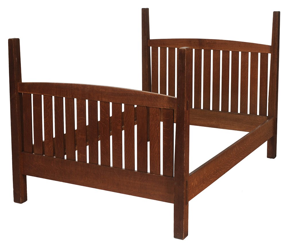 American Arts and Crafts Oak: Bedstead L. & J. G. Stickley, early 20th century, through-tenon construction, slatted head and footboard, 56 x 58 x 83 in., good condition, surface cleaned but apparently not refinished, some scat