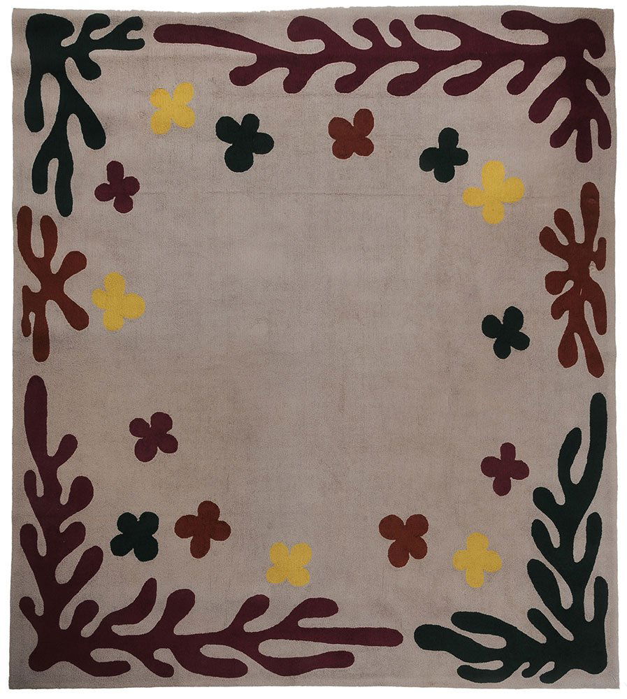 Edward Fields Carpet, Style of Matisse: late 20th century, hooked construction, freeform seaweed and four lobed patterns in yellow, green, rust, and burgundy on grey ground, verso marked ?Edward Fields Inc. Copyright 1981 22926?, 9 ft. 9 in
