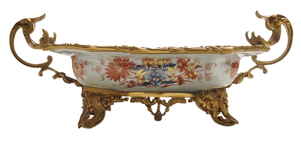 Gilt Bronze Mounted Octagonal Deep: Imari Footed Bowl Chinese, possibly Kangxi period, bowl now set with 19th century French ormolu bronze mounts with two handles and footed base, bowl in underglaze blue willow and flower design, overgl