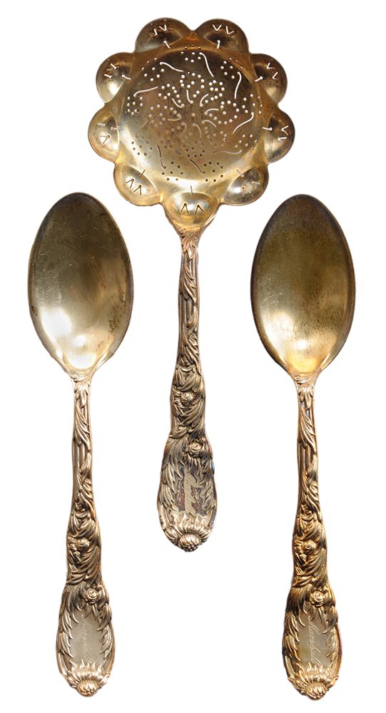 Thirteen Pieces Tiffany Chrysanthemum: Gilt Sterling Flatware American, 1873-1891, including twelve 5-3/4 in. teaspoons and pierced sugar sifter 6-1/4 in., marks for Tiffany, inscribed "Marshall", 19.66 oz. T., good condition. Prov