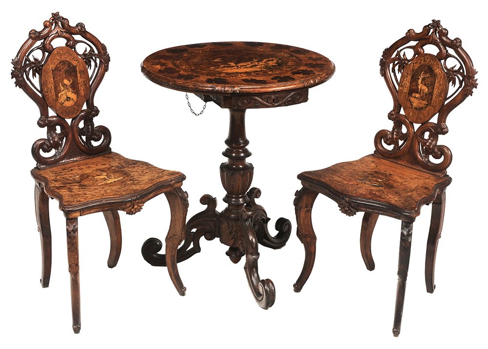 Rustic Black Forest Stag and Eagle: Marquetry-Inlaid Center Table, Pair Side Chairs German or Swiss, late 19th century, center table with tilting top, central marquetry and penwork panel depicting an eagle in flight over three mountain 
