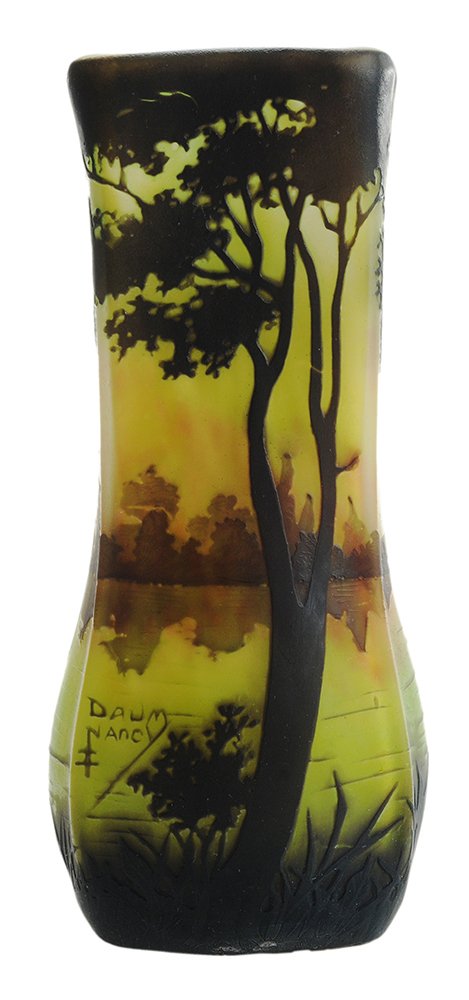 Daum Cameo Glass Landscape Vase: Nancy, France, early 20th century, tall rectangular shape slightly bulbous near bottom rises to straight neck and opening, base glass of green and yellow with red accents overlaid with black silhouett