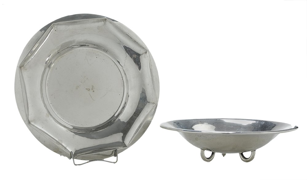 Two German Silver Bowls: 20th century, one round with loop feet, light hammered finish, [one foot pushed in, small dents]; one round with faceted border, [rim with two spots of repair], both with marks for .800 fine, no monog