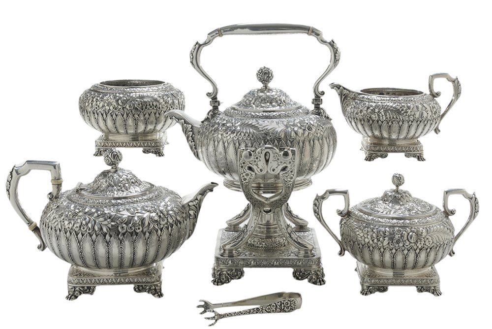 Elaborate Six-Piece Kirk Sterling Tea: Silver Tea Service American, 1896-1924, round body with acanthus and floral decoration, square bases with winged paw feet, marks for S. Kirk & Son Co., "1787", (Baltimore, Maryland), no monograms, 151