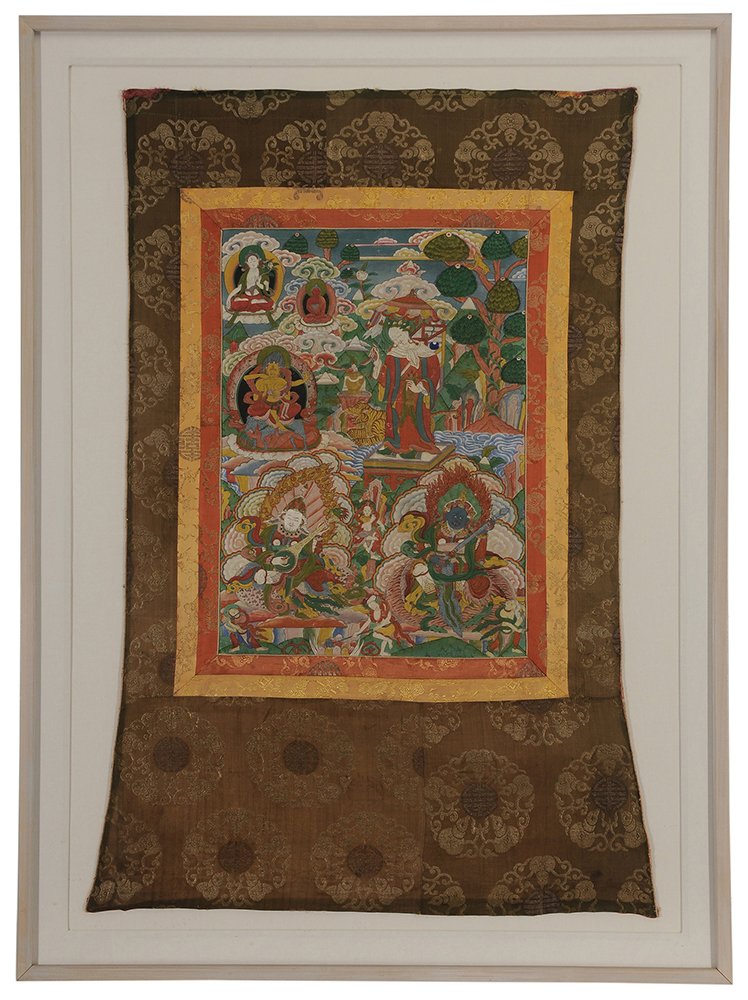 Tibetan Tanka: early 20th century, painting of Buddhist figures with multiple brocaded silk borders, 46 x 31 in. (sight); wood frame 54 x 40 in., abrasions to Tanka surface, fading to silk, not examined out of frame