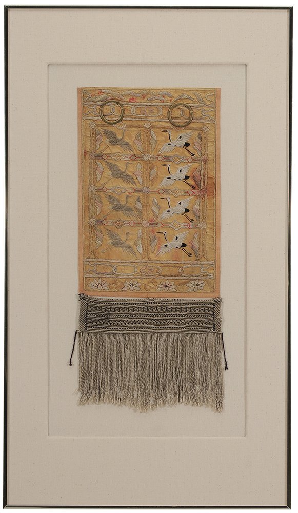 Korean Silk Embroidered Panel: late 19th century, gold sash with silver fringe, two gold rings at top, grey and white cranes facing each other, 23 x 10 in. (sight); metal frame 36 x 21 in., Greenville County Museum o Art (label ver