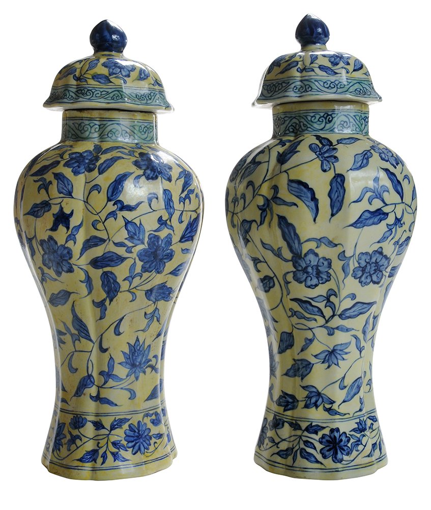 Pair Ming Style Covered Vases: Chinese, late 19th/20th century, leaves, vines and blue flowers on yellow ground, double banding at base, base with spurious six-character mark in blue with double ring, 16-3/4 in., one with old crack