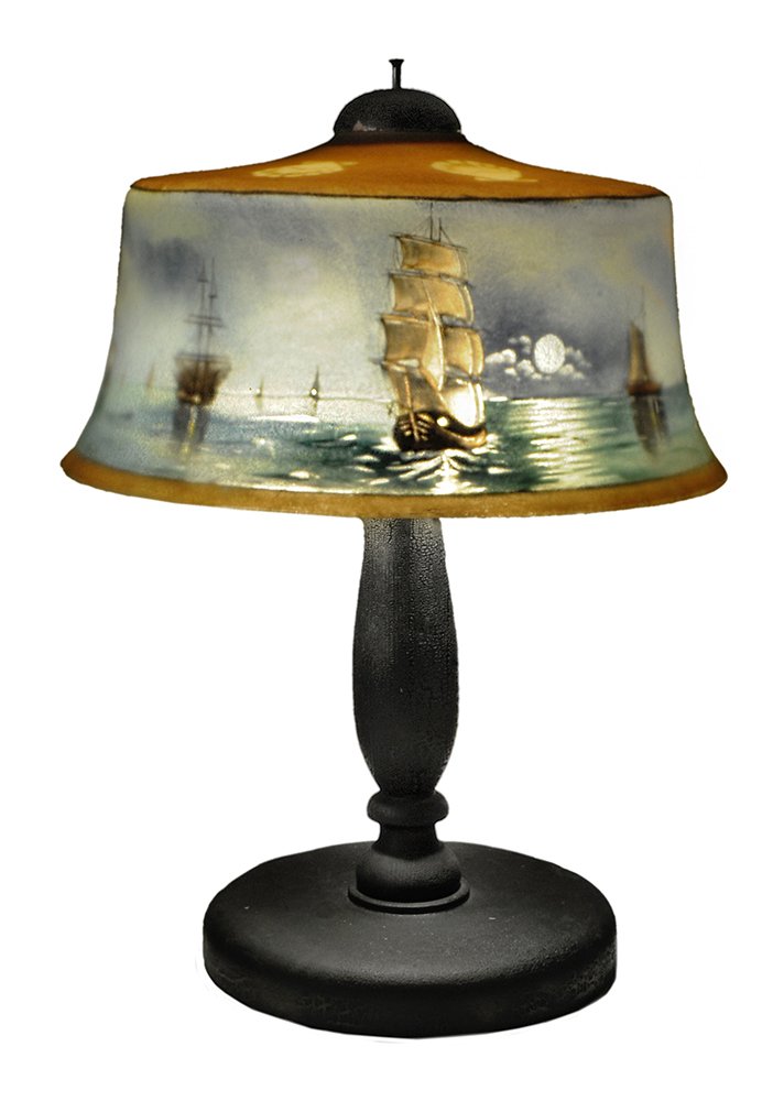 Pairpoint Scenic Reverse-Painted Glass: Table Lamp American, early 20th century, bombé-form glass shade with painted scallop-shell border, shoulders and sides with harbor scenes of sailing ships, marked inside base rim "The Pairpoint C